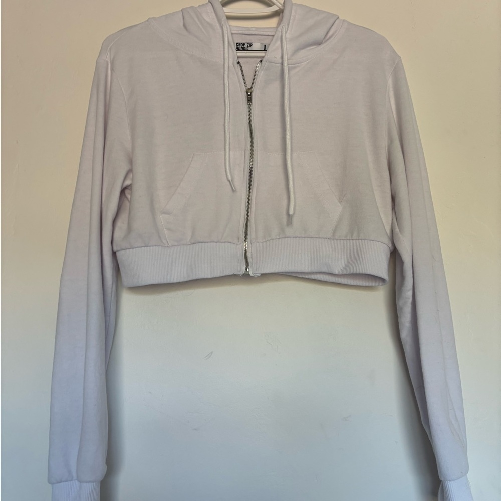 Brand is refuge athletics. Size L. Color is white.